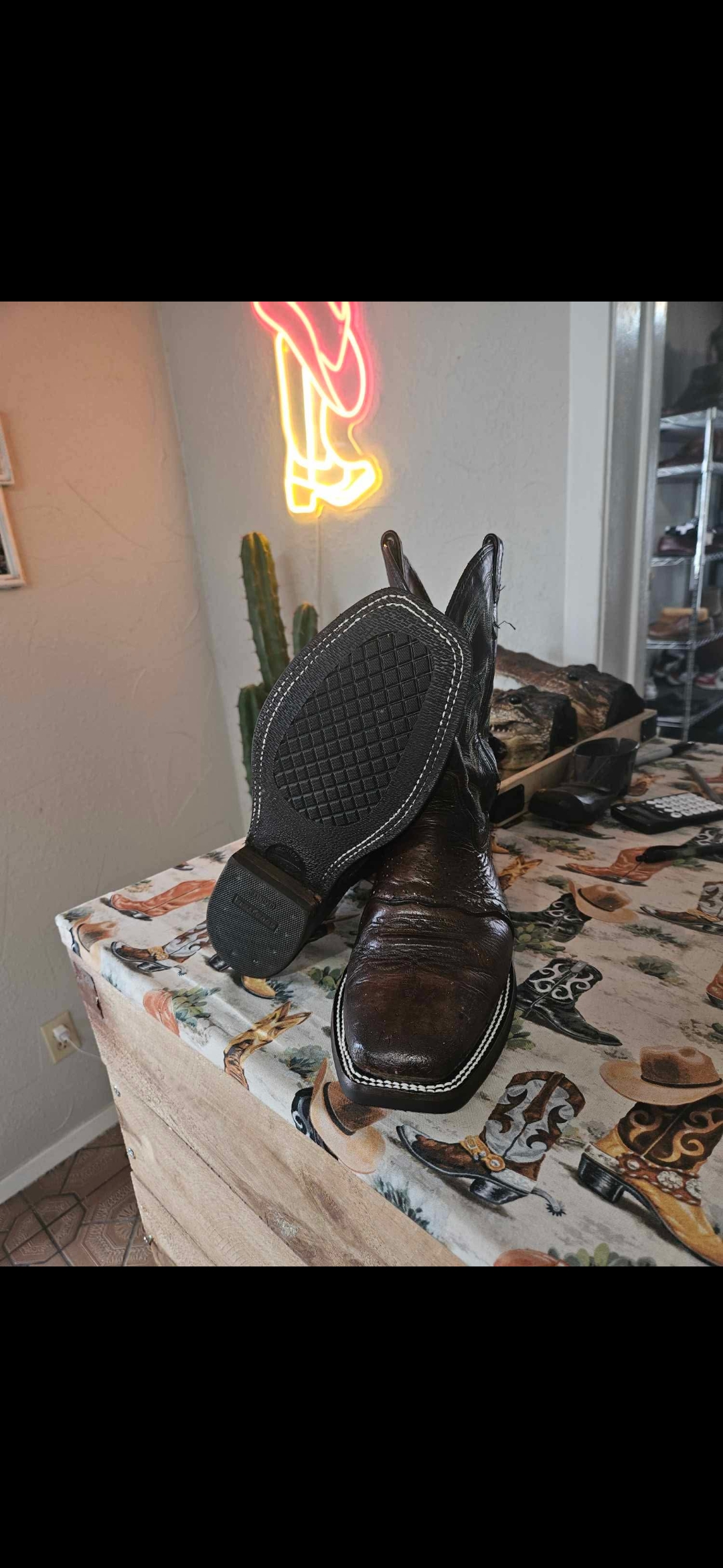 Dark western boots after half-sole and polish